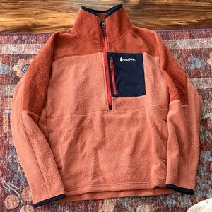 Cotopaxi Fleece in Orange and Navy
